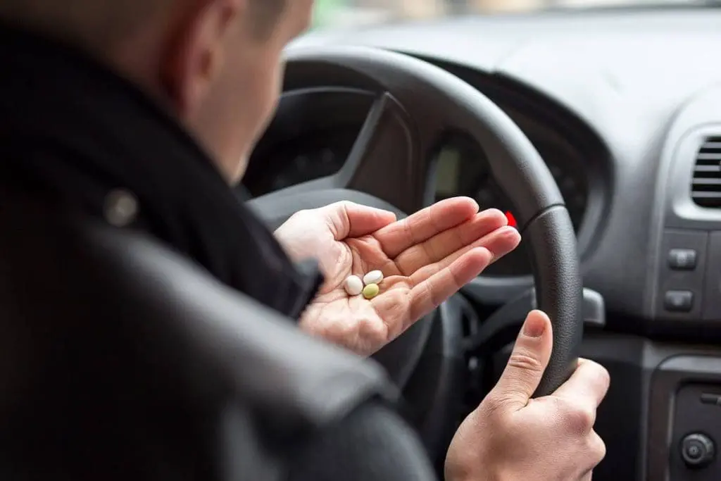 Truck driver evaluating medication, underscoring the intricacies of DOT mental health requirements