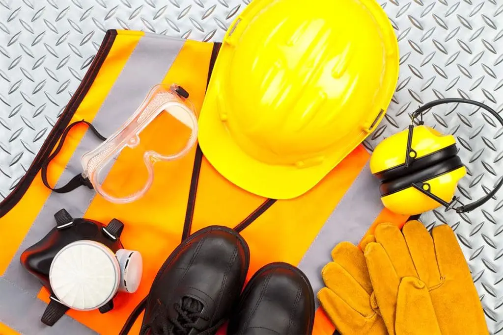 Personal protective equipment including a hard hat, goggles, and gloves.