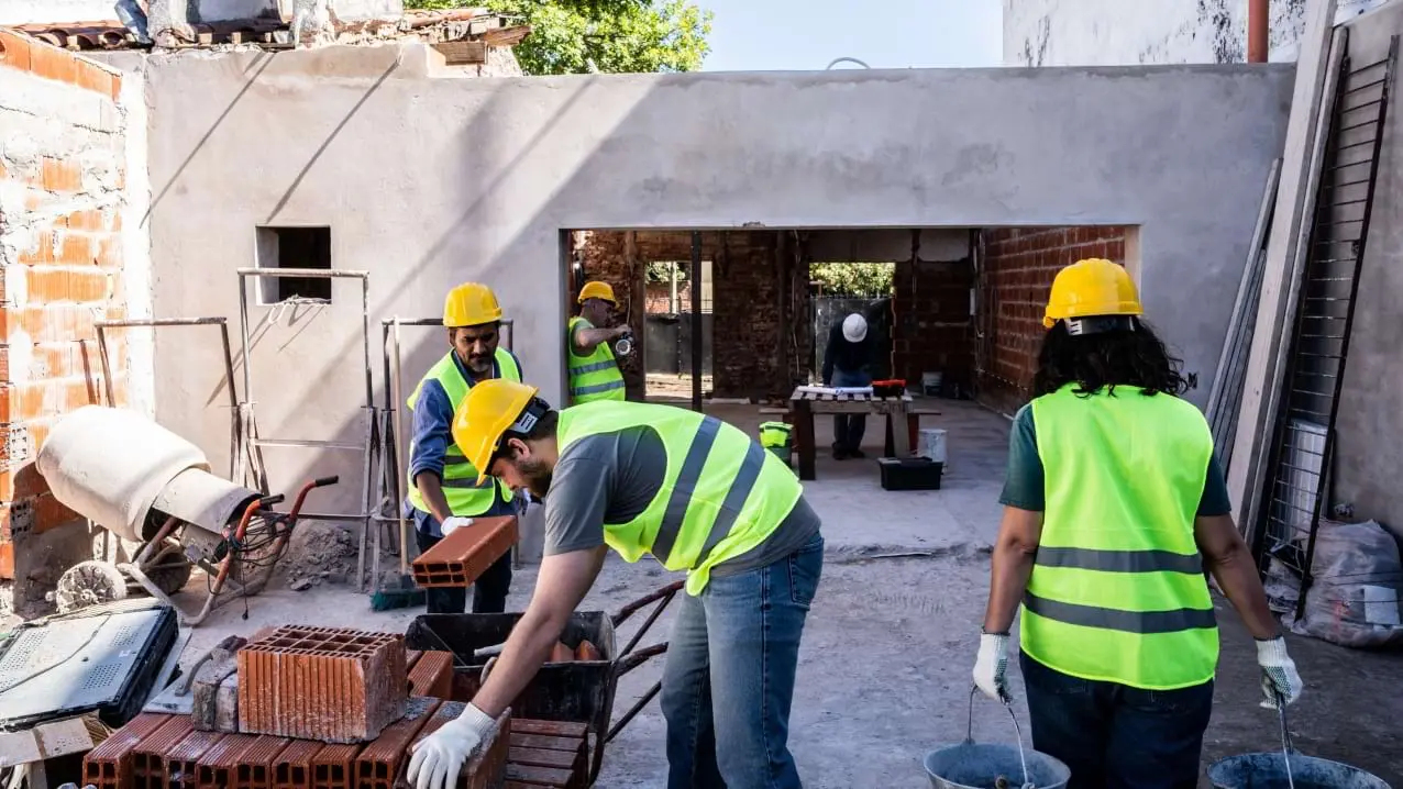 Construction crew working safely after UXO clearance in a former conflict area