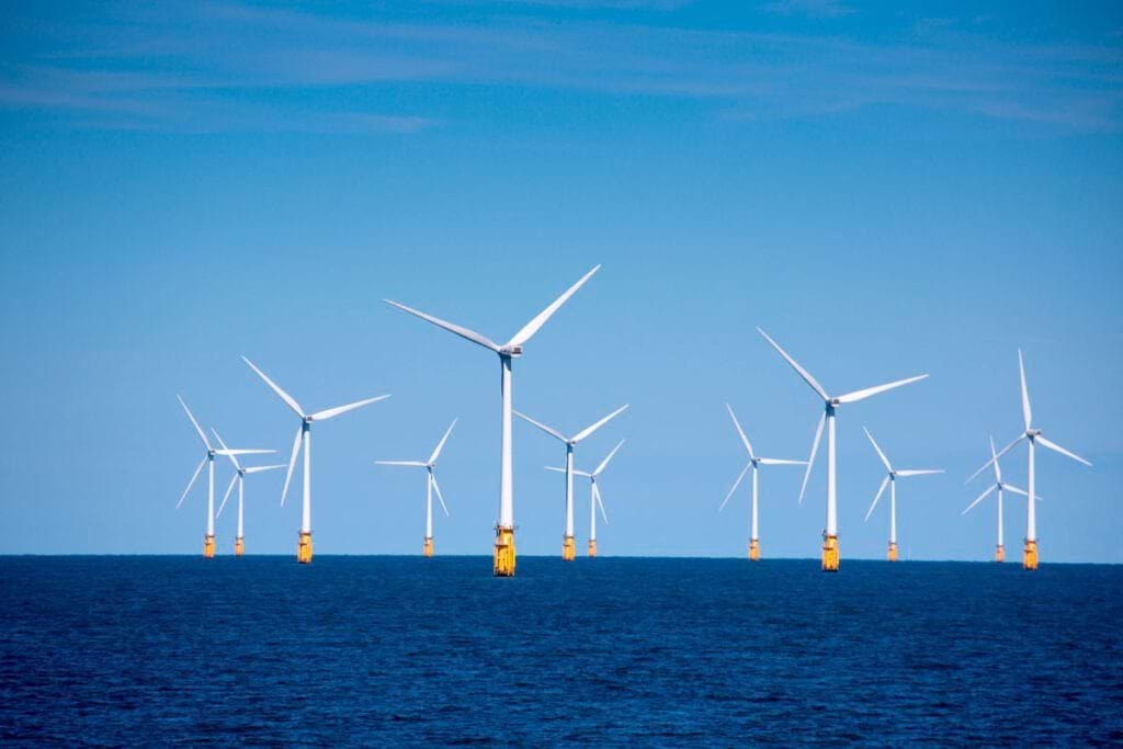 Offshore wind turbines illustrating Acuity International's comprehensive services for improving safety and productivity in the renewable energy sector