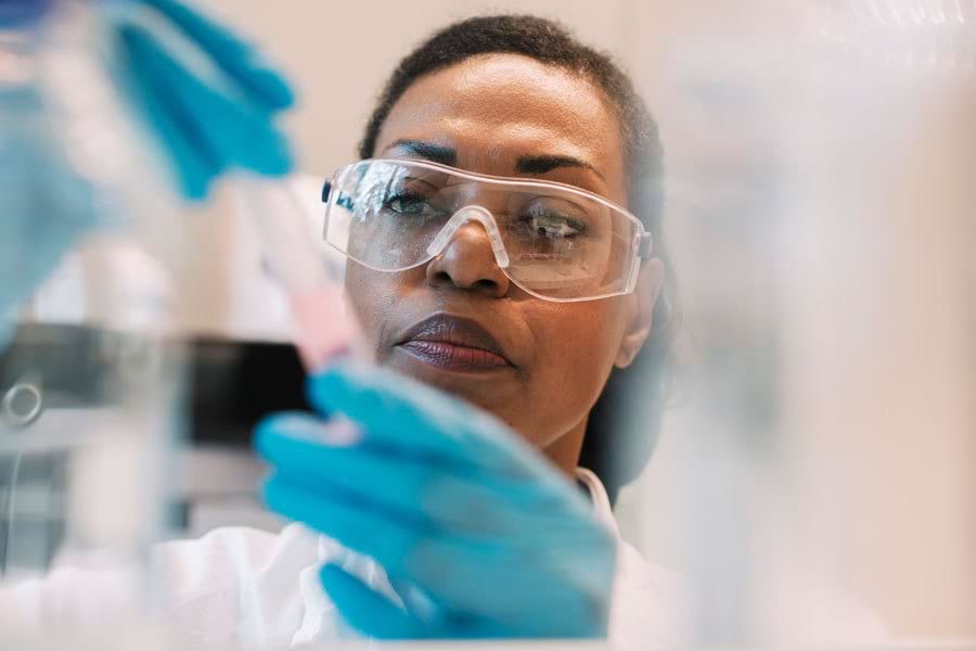 Scientist preparing a urine sample for an HHS DOT mirror drug test
