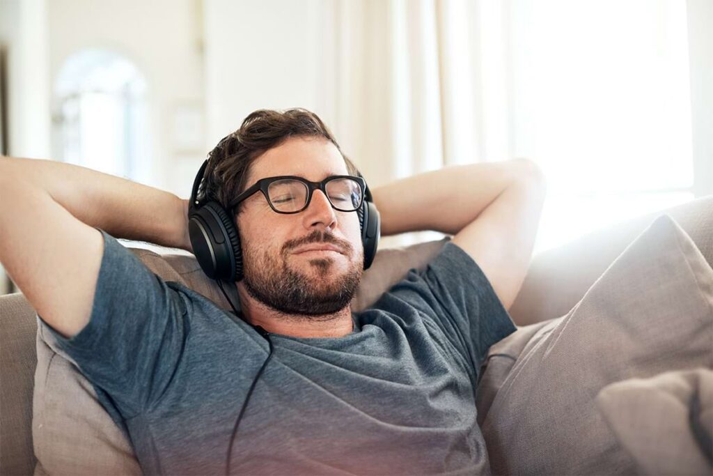 Veteran relaxing with noise-canceling headphones